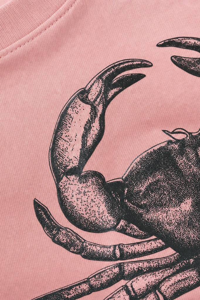 Close-up fabric detail - Off supply The crab pink t-shirt