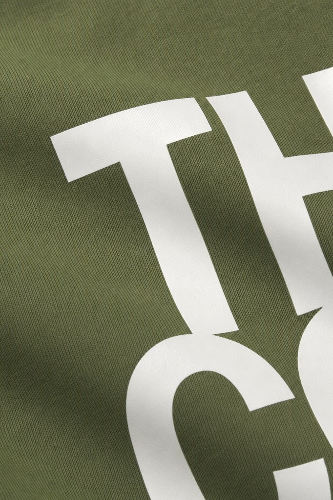 Close-up fabric detail - Off supply They come they go Olive T-shirt