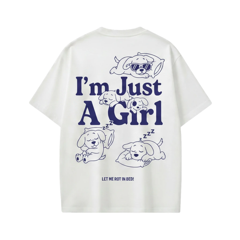 Off Supply white 100% cotton t-shirt with oversized fit and navy graphic of dogs sleeping and text "I'm Just A Girl".